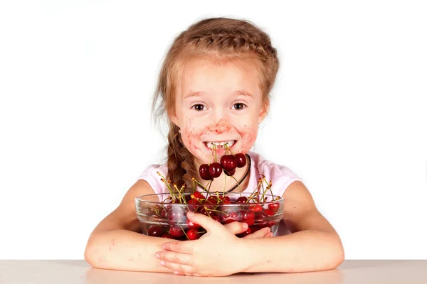 A child with a bowl fresh cherry Royalty Free Stock Images