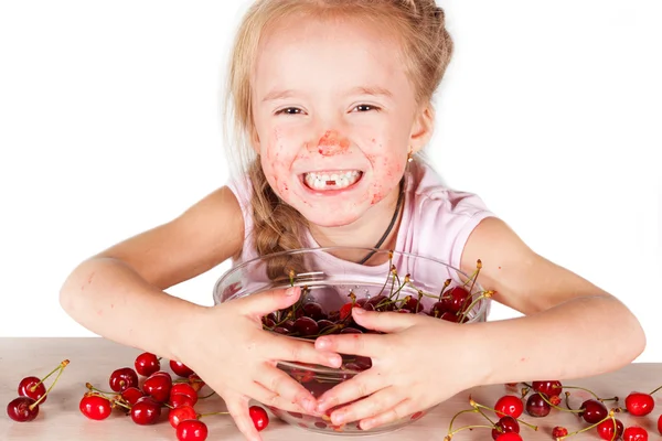 A child with a bowl fresh cherry Royalty Free Stock Images