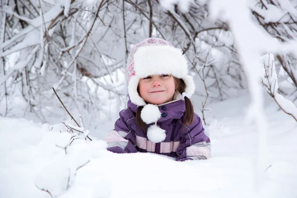 Wonderful child in the snowy woods — Stock Photo, Image