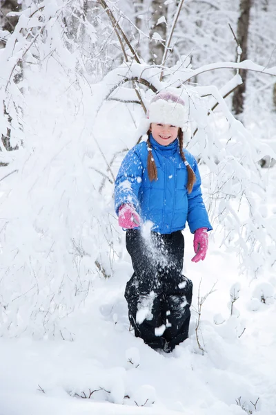 Wonderful child in the snowy woods — Stock Photo, Image