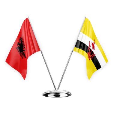 Two table flags isolated on white background 3d illustration, albenia and brunei