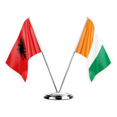Two table flags isolated on white background 3d illustration, albenia and ivory coast