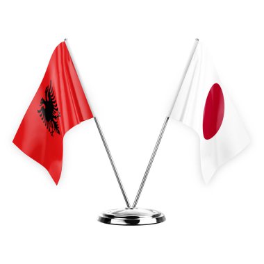 Two table flags isolated on white background 3d illustration, albenia and japan