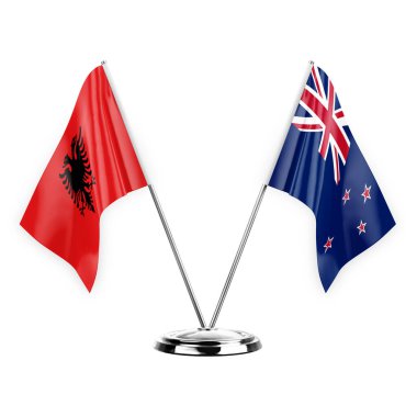 Two table flags isolated on white background 3d illustration, albenia and new zealand