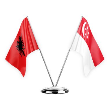 Two table flags isolated on white background 3d illustration, albenia and singapore