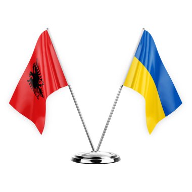 Two table flags isolated on white background 3d illustration, albenia and ukraine