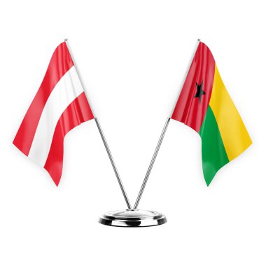 Two table flags isolated on white background 3d illustration, austria and guinea-bissau