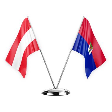 Two table flags isolated on white background 3d illustration, austria and haiti