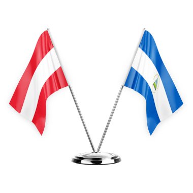 Two table flags isolated on white background 3d illustration, austria and nicaragua