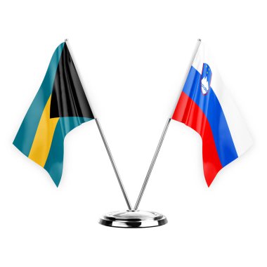 Two table flags isolated on white background 3d illustration, bahamas and slovenia