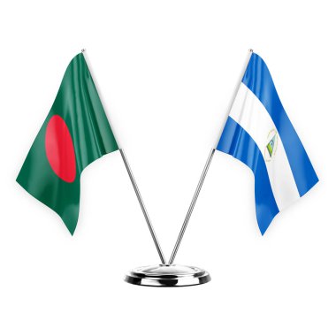 Two table flags isolated on white background 3d illustration, bangladesh and nicaragua