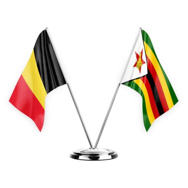 Two table flags isolated on white background 3d illustration, belgium and zimbabwe