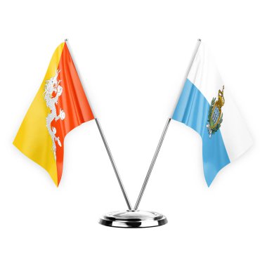 Two table flags isolated on white background 3d illustration, bhutan and san marino