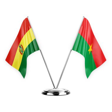 Two table flags isolated on white background 3d illustration, bolivia and burkina faso