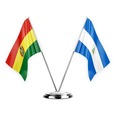 Two table flags isolated on white background 3d illustration, bolivia and nicaragua