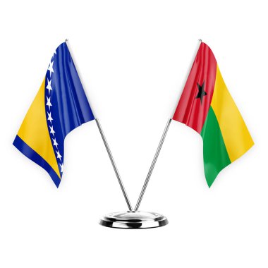 Two table flags isolated on white background 3d illustration, bosnia and guinea-bissau