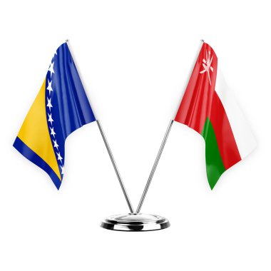 Two table flags isolated on white background 3d illustration, bosnia and oman
