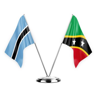 Two table flags isolated on white background 3d illustration, botswana and saint kitts and venis