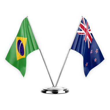 Two table flags isolated on white background 3d illustration, brazil and new zealand