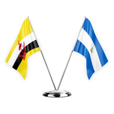 Two table flags isolated on white background 3d illustration, brunei and nicaragua