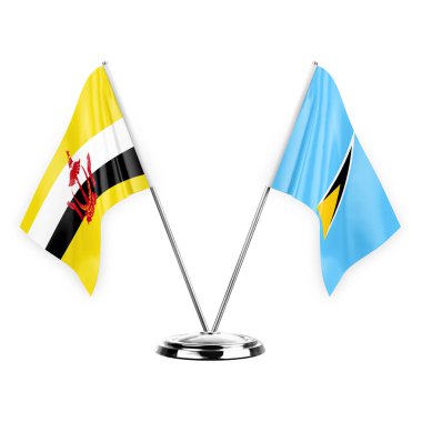 Two table flags isolated on white background 3d illustration, brunei and saint lucia