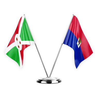 Two table flags isolated on white background 3d illustration, burundi and haiti
