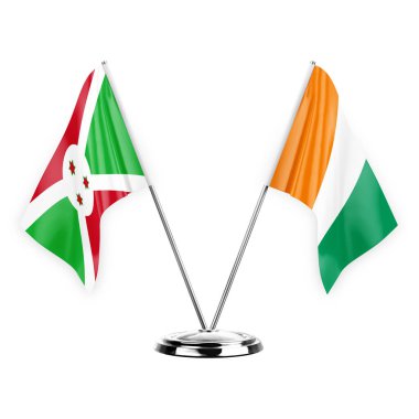 Two table flags isolated on white background 3d illustration, burundi and ivory coast