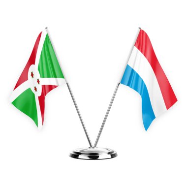 Two table flags isolated on white background 3d illustration, burundi and luxembourg