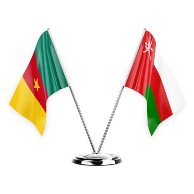 Two table flags isolated on white background 3d illustration, cameroon and oman