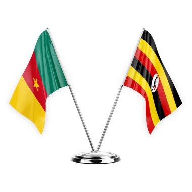 Two table flags isolated on white background 3d illustration, cameroon and uganda