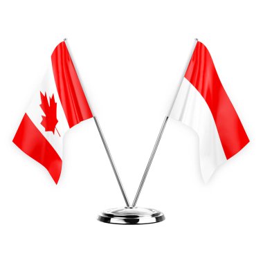 Two table flags isolated on white background 3d illustration, canada and indonesia