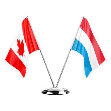 Two table flags isolated on white background 3d illustration, canada and luxembourg