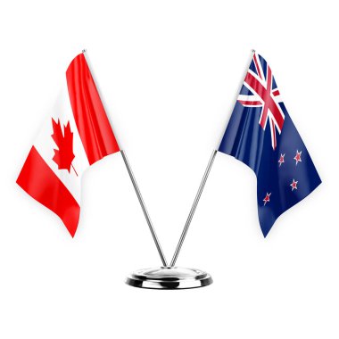 Two table flags isolated on white background 3d illustration, canada and new zealand