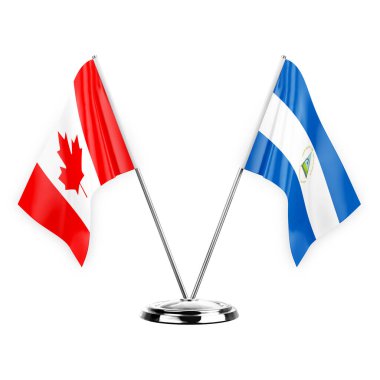 Two table flags isolated on white background 3d illustration, canada and nicaragua