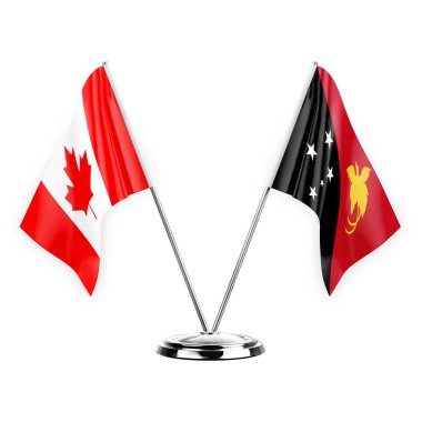 Two table flags isolated on white background 3d illustration, canada and papua new guinea