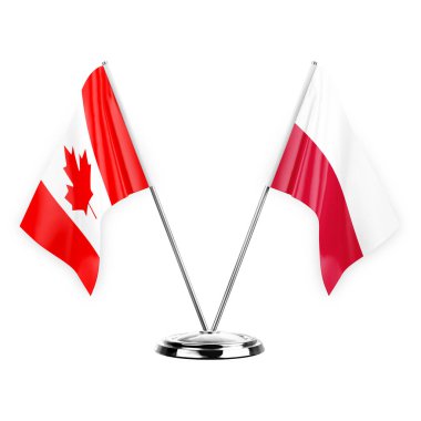 Two table flags isolated on white background 3d illustration, canada and poland