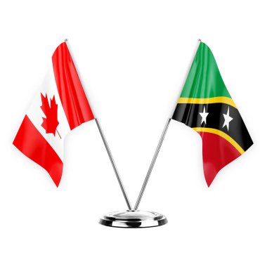 Two table flags isolated on white background 3d illustration, canada and saint kitts and venis