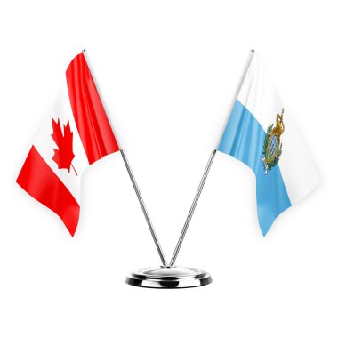 Two table flags isolated on white background 3d illustration, canada and san marino