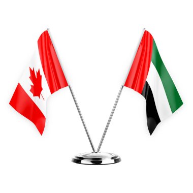 Two table flags isolated on white background 3d illustration, canada and united arab emirates