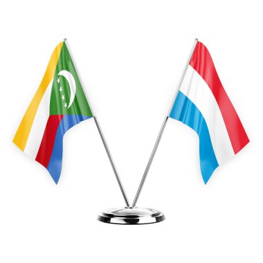 Two table flags isolated on white background 3d illustration, comoros and luxembourg