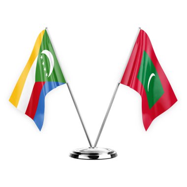 Two table flags isolated on white background 3d illustration, comoros and maldives