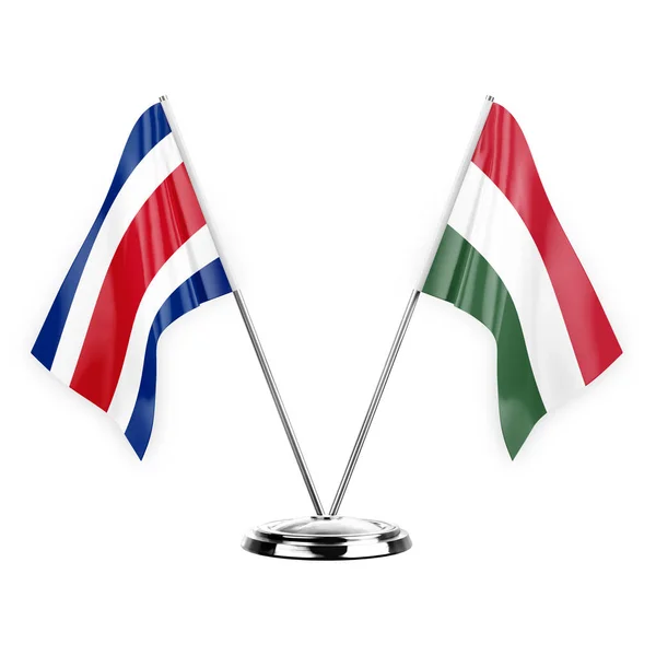 白い背景の3Dイラスト コスタリカとハンガリーに隔離された2つのテーブルフラグ — ストック写真