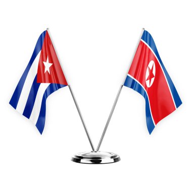 Two table flags isolated on white background 3d illustration, cuba and north korea