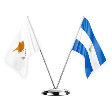 Two table flags isolated on white background 3d illustration, cyprus and nicaragua