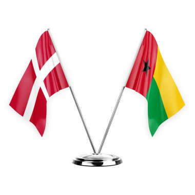 Two table flags isolated on white background 3d illustration, denmark and guinea-bissau