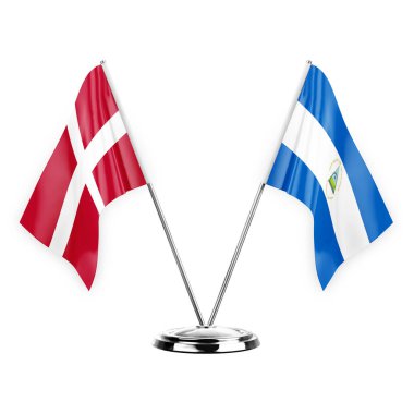 Two table flags isolated on white background 3d illustration, denmark and nicaragua