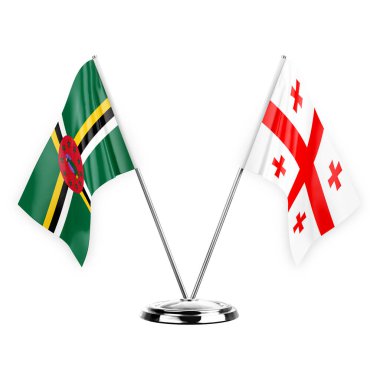Two table flags isolated on white background 3d illustration, dominica and georgia