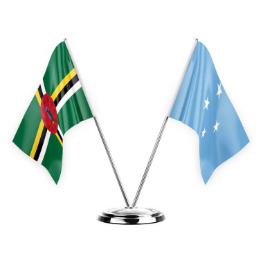 Two table flags isolated on white background 3d illustration, dominica and micronesia