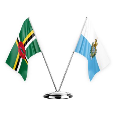 Two table flags isolated on white background 3d illustration, dominica and san marino