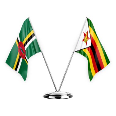 Two table flags isolated on white background 3d illustration, dominica and zimbabwe